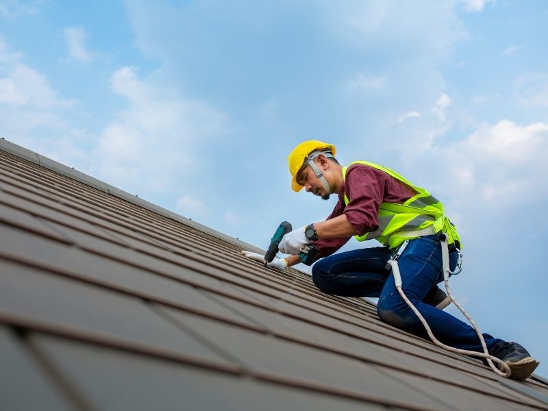 Roof repair work in progress on a residential home